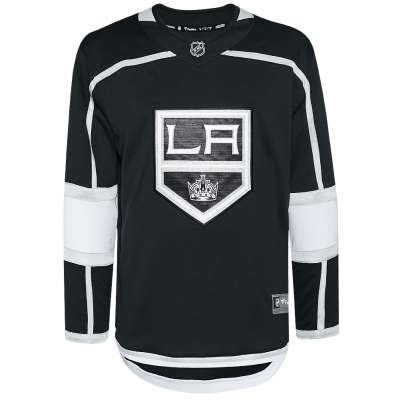 Homme en maillot de hockey sur glace rouge et blanc équitation sur